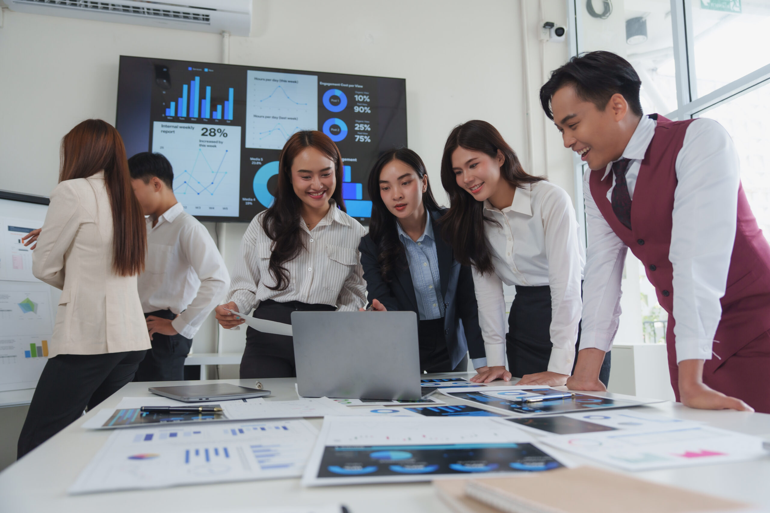 asian business team analyzing charts on laptop and 2025 06 22 19 42 57 utc scaled.jpg